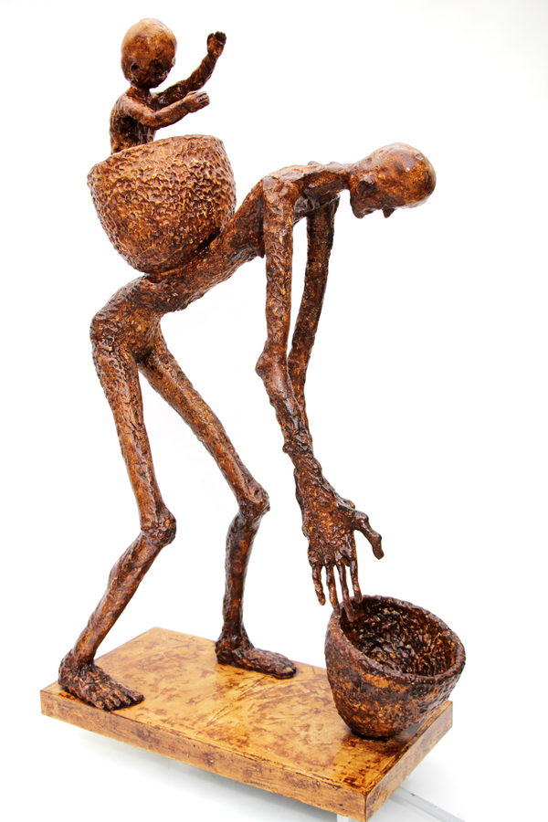 A rust-coloured figure bends forward, carrying a child in a basket, with a second basket at its feet.