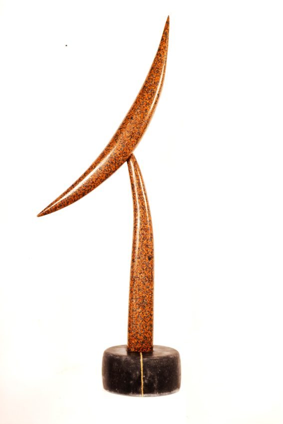 Rust-coloured abstract sculpture with curved intersecting elements