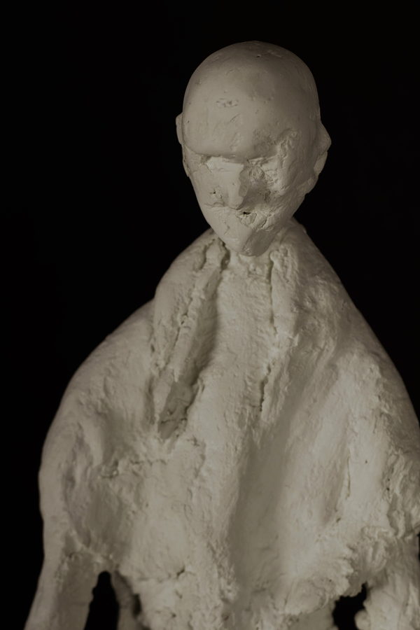 Elongated Sculpture by Valeriu Cazacevschi. Close view of the textured head, chest and shoulders.