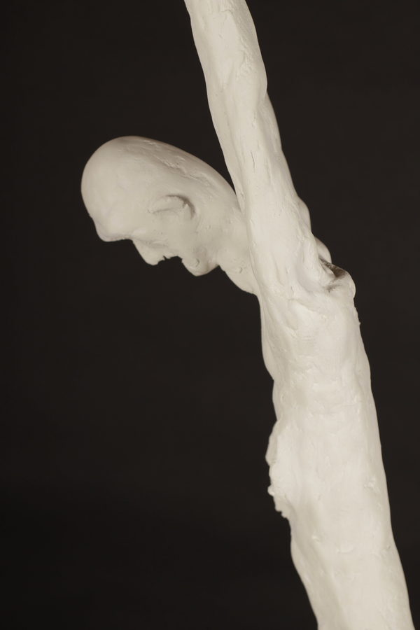 The Monk by Valeriu Cazacevschi. Side detail of the bowed face, shoulder and raised arm.